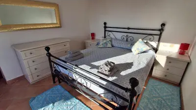 Letto o letti in una camera di Appartamento Alfieri a Porto San Paolo