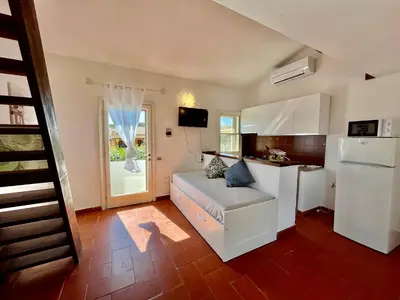 Area soggiorno di Carasau 200m from the Beach - Garden - BBQ - Wi-Fi - Parking - Pet Friendly