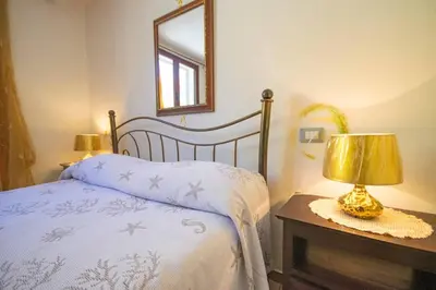 Letto o letti in una camera di Appartamenti Fronte Mare