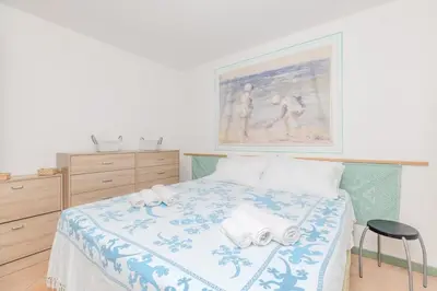 Letto o letti in una camera di oasi sul mare - a due passi dalle spiaggie