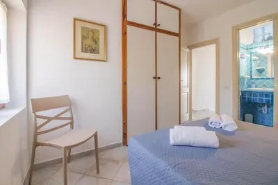 Letto o letti in una camera di GuestHost - Seaview Villa with Veranda GolfoAranci