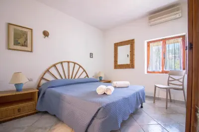 Letto o letti in una camera di GuestHost - Seaview Villa with Veranda GolfoAranci