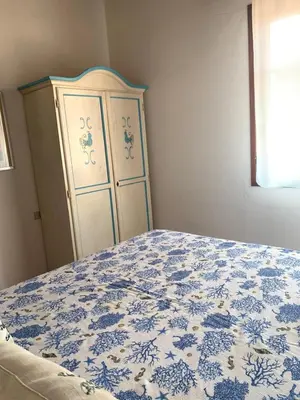 Letto o letti in una camera di Splendido appartamento San Teodoro centro