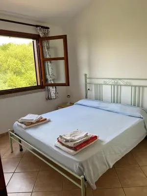 Letto o letti in una camera di Residence Uliveto