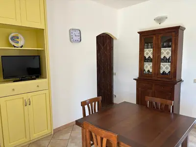TV o dispositivi per l'intrattenimento presso Villetta in Sardegna piano terra con giardino