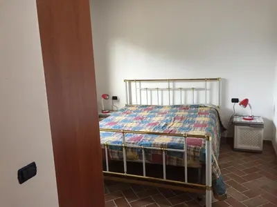 Letto o letti in una camera di Casa Corofulu Oliena - IUN P2139