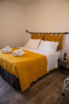 Letto o letti in una camera di La Corte di Giovanni - Guest House