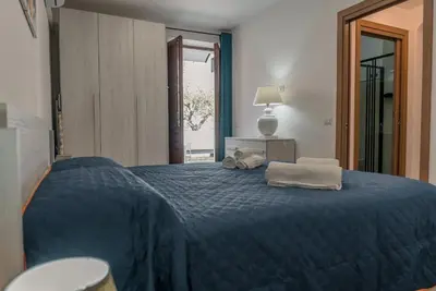 Letto o letti in una camera di Casa dei nonni