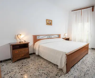 Letto o letti in una camera di Casa Maria