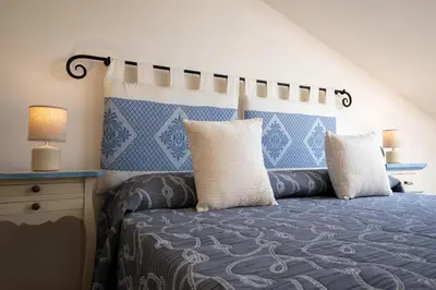 Letto o letti in una camera di Appartamento la Via del Mare by Wonderful Italy