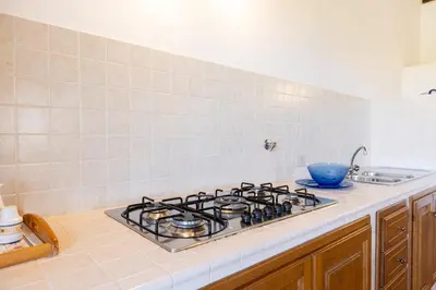 Cucina o angolo cottura di Splendido Stazzo vista mare San Teodoro Lu Fraili