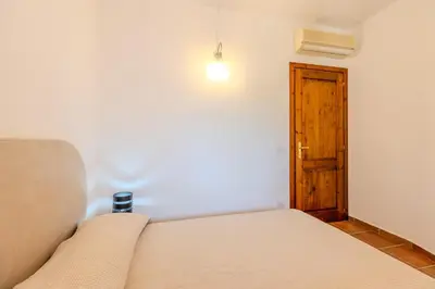 Letto o letti in una camera di Splendido appartamento vista mare San Teodoro
