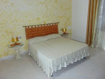 Letto o letti in una camera di Appartamenti Budoni