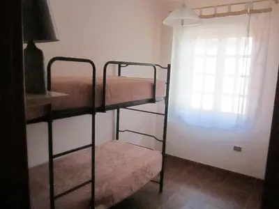 Letto o letti in una camera di Appartamenti Budoni
