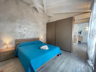 Letto o letti in una camera di Villa Maluva Budoni