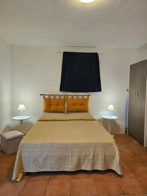 Letto o letti in una camera di Casa Elicriso