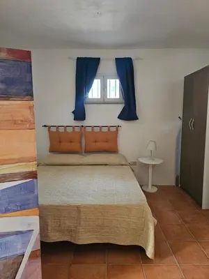 Letto o letti in una camera di Casa Elicriso