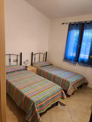 Letto o letti in una camera di Casa Miranda Three-room apartment with a terrace overlooking the sea