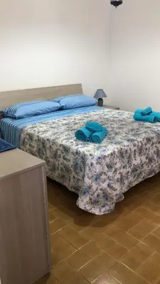 Letto o letti in una camera di Casa Marianna Cala Gonone mare