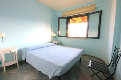 Letto o letti in una camera di Smeraldo - Lovely apartment for vacation
