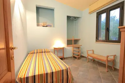 Letto o letti in una camera di Smeraldo - Lovely apartment for vacation