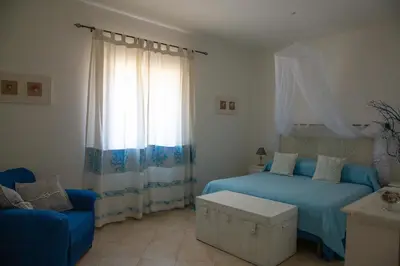 Letto o letti in una camera di La Pavoncella Marina - Cozy home near Porto Taverna