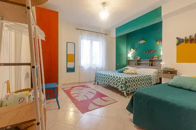 Letto o letti in una camera di Casa Anita-relax e comodità