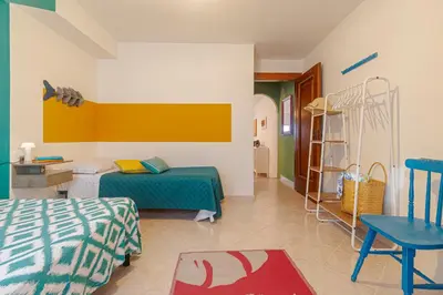 Letto o letti in una camera di Casa Anita-relax e comodità