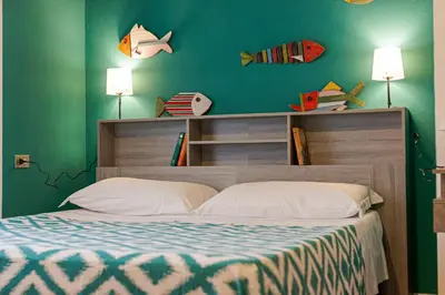 Letto o letti in una camera di Casa Anita-relax e comodità