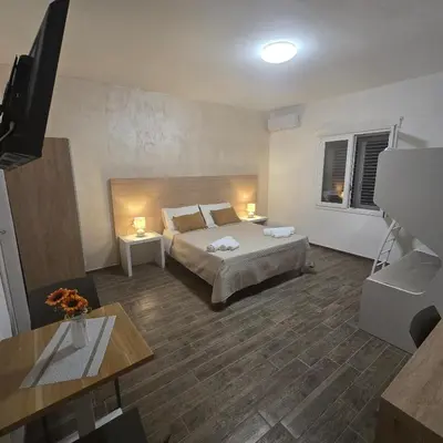 Letto o letti in una camera di Miluna Affittacamere
