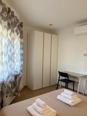 Letto o letti in una camera di La Casetta di Seby - Appartamento moderno a Olbia