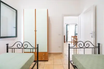 Letto o letti in una camera di AffittaSardegna - Domo Pineta