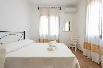 Letto o letti in una camera di AffittaSardegna - Trilo Euforbia