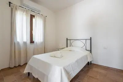 Letto o letti in una camera di AffittaSardegna - Trilo Euforbia