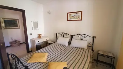 Letto o letti in una camera di Casa Artude