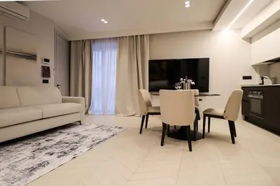 Area soggiorno di Luxurious 1BR AZULIS holiday Suite#1 in historical centre Olbia