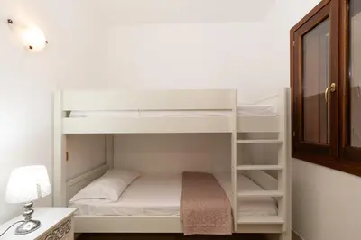 Letto o letti in una camera di Casa di Barbara al Mare by Wonderful Italy