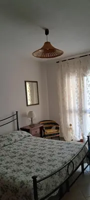 Letto o letti in una camera di Appartamento Susanna