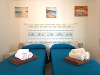 Letto o letti in una camera di Villetta Lucy - Budoni Sweet Home