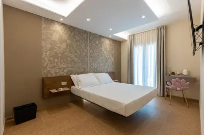 Letto o letti in una camera di MIRARI Design Rooms
