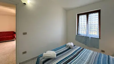 Letto o letti in una camera di La Casa di Anna - Trilocale 6 posti letto San Teodoro