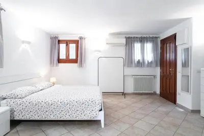 Letto o letti in una camera di Casa in Pietra-10 MIN FROM THE SEA