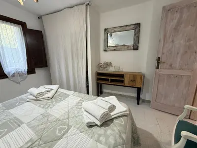 Letto o letti in una camera di CASA MURALES Gianfranco