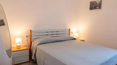 Letto o letti in una camera di Casa Vacanza la Suaredda