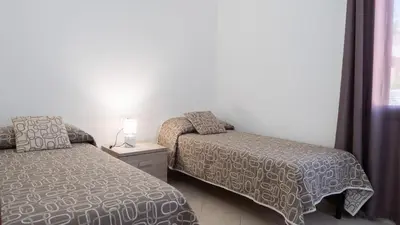 Letto o letti in una camera di Casa Vacanza la Suaredda