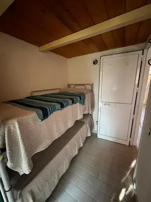 Letto o letti in una camera di Casa Tamerici