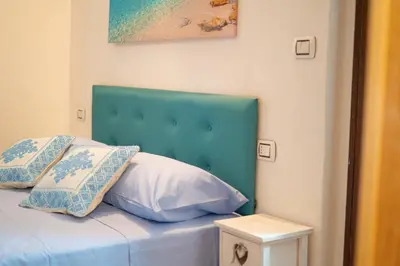 Letto o letti in una camera di B&B Sinis Domus