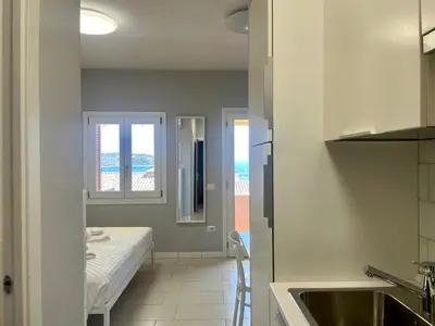 Letto o letti in una camera di Monolocale Terrazza Vista Mare
