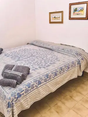 Letto o letti in una camera di Casa Vacanze Gustui