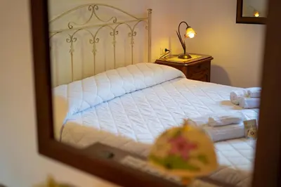 Letto o letti in una camera di Casa delle Sorgenti 2